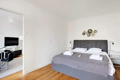 Un ou plusieurs lits dans un hébergement de l'établissement Chic apartment - 1BR-4P - Next to Paris