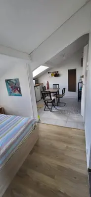 Coin salon dans l'établissement Cosy studio Clichy Levallois