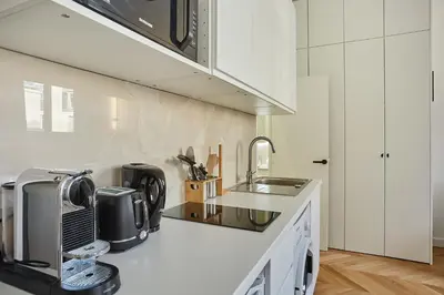 Cuisine ou kitchenette dans l'établissement Studio Arc de Triomphe by Studio prestige