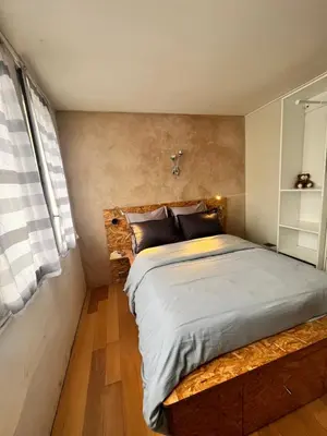 Un ou plusieurs lits dans un hébergement de l'établissement Appartement cosy près de la Seine