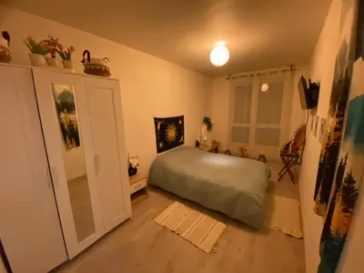 Un ou plusieurs lits dans un hébergement de l'établissement Appartement meublé et cosy