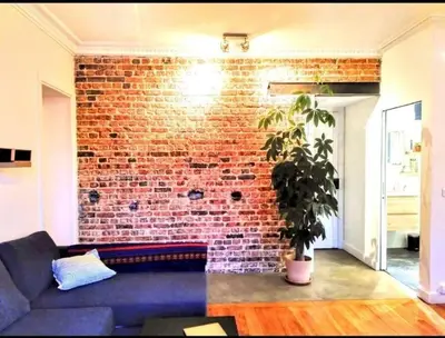 Coin salon dans l'établissement Appartement lumineux - vue sur le canal