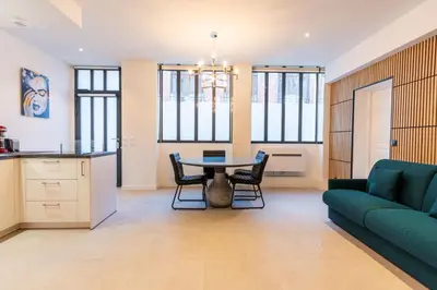 Coin salon dans l'établissement Loft 1 BR jardin des plantes AC by LCC Agency
