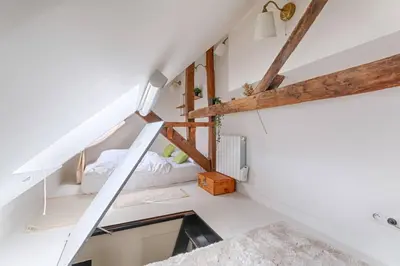 Un ou plusieurs lits dans un hébergement de l'établissement MyKeypers - Fantastic Designed Parisan LOFT 2BR/6P- Le Marais