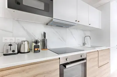 Cuisine ou kitchenette dans l'établissement MyKeypers - Chic & Cozy Flat 4P - République