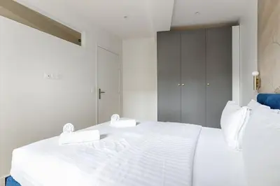 Un ou plusieurs lits dans un hébergement de l'établissement MyKeypers - Chic & Cozy Flat 4P - République