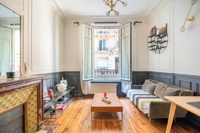 Coin salon dans l'établissement Charming and cosy apartment near Montmartre and Stade de France