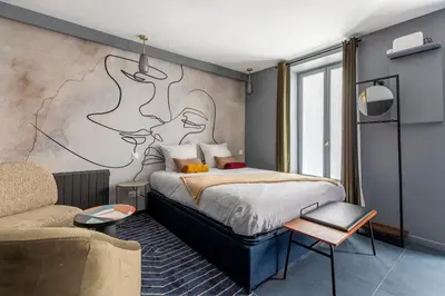 Un ou plusieurs lits dans un hébergement de l'établissement Opéra, Grand Boulevard 9ème, suite avec jacuzzi