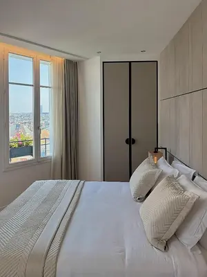 Un ou plusieurs lits dans un hébergement de l'établissement Montmartre Residence