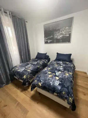 Un ou plusieurs lits dans un hébergement de l'établissement Appartement au Pied du Metro Mairie de Clichy L13