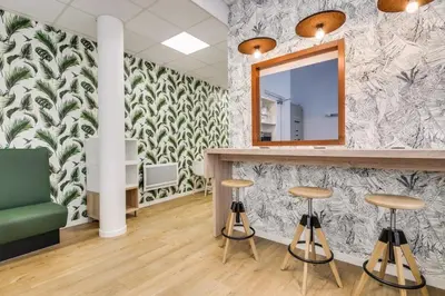 Coin salon dans l'établissement Appartement au Pied du Metro Mairie de Clichy L13