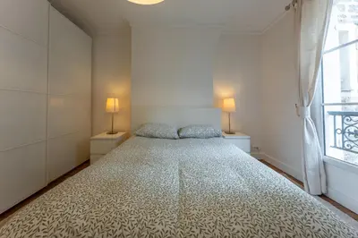 Un ou plusieurs lits dans un hébergement de l'établissement Appartement de luxe Champs Elysees Neuf