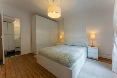 Un ou plusieurs lits dans un hébergement de l'établissement Appartement de luxe Champs Elysees Neuf
