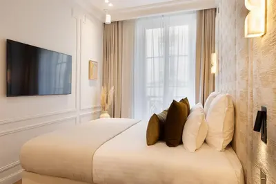 Un ou plusieurs lits dans un hébergement de l'établissement TheLander - Serviced Apartments in Champs Elysées