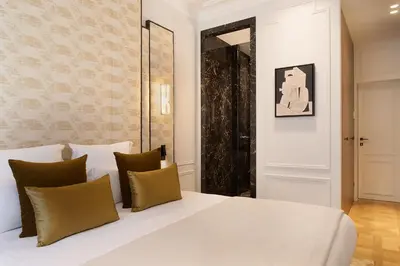 Un ou plusieurs lits dans un hébergement de l'établissement TheLander - Serviced Apartments in Champs Elysées