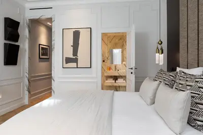 Un ou plusieurs lits dans un hébergement de l'établissement TheLander - Serviced Apartments in Champs Elysées
