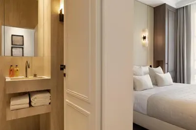 Un ou plusieurs lits dans un hébergement de l'établissement TheLander - Serviced Apartments in Champs Elysées