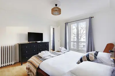 Un ou plusieurs lits dans un hébergement de l'établissement Peaceful apartment 2BR-4P - Arc de Triomphe