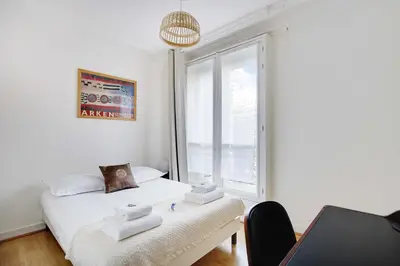 Un ou plusieurs lits dans un hébergement de l'établissement Peaceful apartment 2BR-4P - Arc de Triomphe