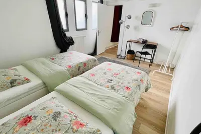 Un ou plusieurs lits dans un hébergement de l'établissement Maison/loft Paris 14eme