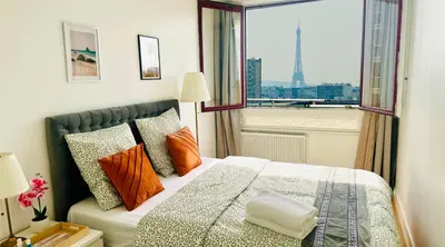 Un ou plusieurs lits dans un hébergement de l'établissement paris holiday