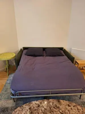 Un ou plusieurs lits dans un hébergement de l'établissement Appartement 35 m² dans le Marais