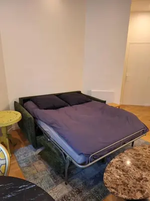 Un ou plusieurs lits dans un hébergement de l'établissement Appartement 35 m² dans le Marais