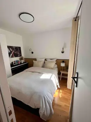 Un ou plusieurs lits dans un hébergement de l'établissement Appartement d'architecte, Paris-République 2P