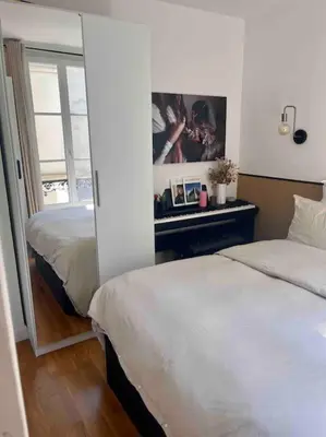 Un ou plusieurs lits dans un hébergement de l'établissement Appartement d'architecte, Paris-République 2P