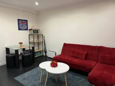 Coin salon dans l'établissement charmant appartement : la défense/Paris/Arena