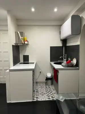 Cuisine ou kitchenette dans l'établissement charmant appartement : la défense/Paris/Arena
