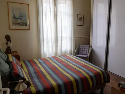 Un ou plusieurs lits dans un hébergement de l'établissement Appartement duplex avec jardin à deux pas de Paris
