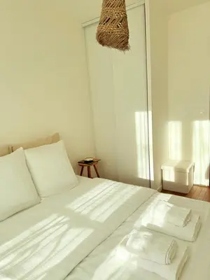 Un ou plusieurs lits dans un hébergement de l'établissement Cozy apartment near Paris