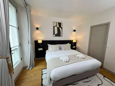 Un ou plusieurs lits dans un hébergement de l'établissement Saint Germain des Pres - Prestige apartment with lift for 6