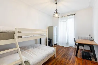Un ou plusieurs lits dans un hébergement de l'établissement GuestReady -Apt familial en bordure de la Capitale