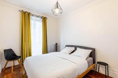 Un ou plusieurs lits dans un hébergement de l'établissement GuestReady -Apt familial en bordure de la Capitale