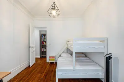 Un ou plusieurs lits dans un hébergement de l'établissement GuestReady -Apt familial en bordure de la Capitale