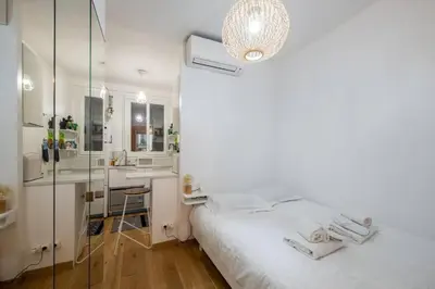 Un ou plusieurs lits dans un hébergement de l'établissement Appartement cosy avec terrasse