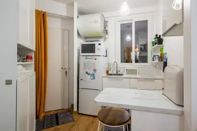 Cuisine ou kitchenette dans l'établissement Appartement cosy avec terrasse
