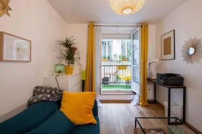 Coin salon dans l'établissement Appartement cosy avec terrasse