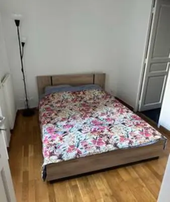 Un ou plusieurs lits dans un hébergement de l'établissement Champs-Élysées appartment 4 beds