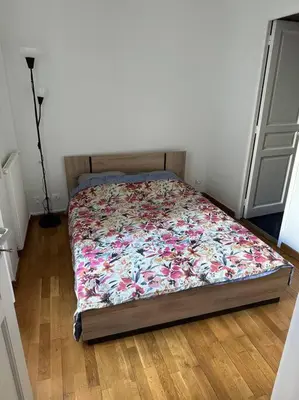 Un ou plusieurs lits dans un hébergement de l'établissement Champs-Élysées appartment 4 beds