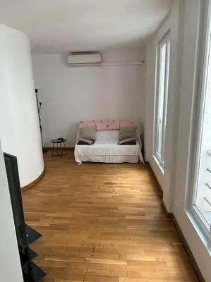 Un ou plusieurs lits dans un hébergement de l'établissement Champs-Élysées appartment 4 beds