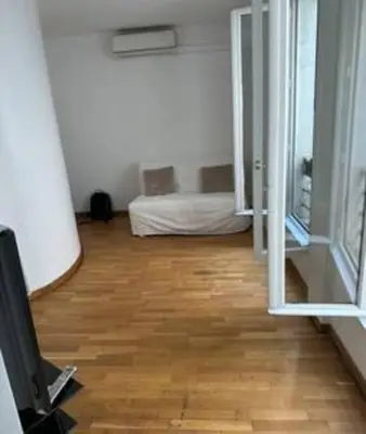Un ou plusieurs lits dans un hébergement de l'établissement Champs-Élysées appartment 4 beds