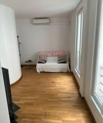 Un ou plusieurs lits dans un hébergement de l'établissement Champs-Élysées appartment 4 beds