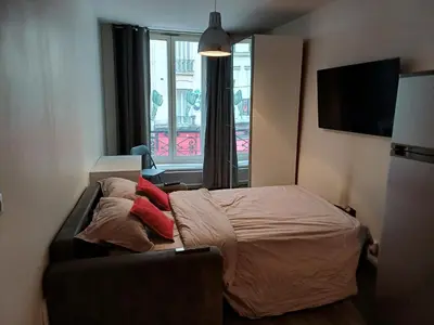 Un ou plusieurs lits dans un hébergement de l'établissement STUDIO CHARONNE