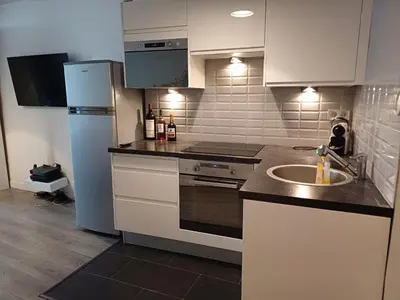 Cuisine ou kitchenette dans l'établissement STUDIO CHARONNE