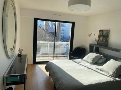 Un ou plusieurs lits dans un hébergement de l'établissement Luxury appartment 10 mn from Champs-Elysées