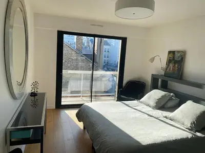 Un ou plusieurs lits dans un hébergement de l'établissement Luxury appartment 10 mn from Champs-Elysées