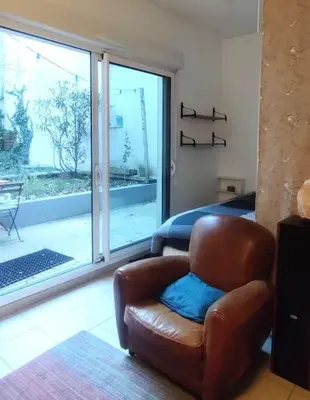 Coin salon dans l'établissement Appartement Jardin Seguin CityCosy